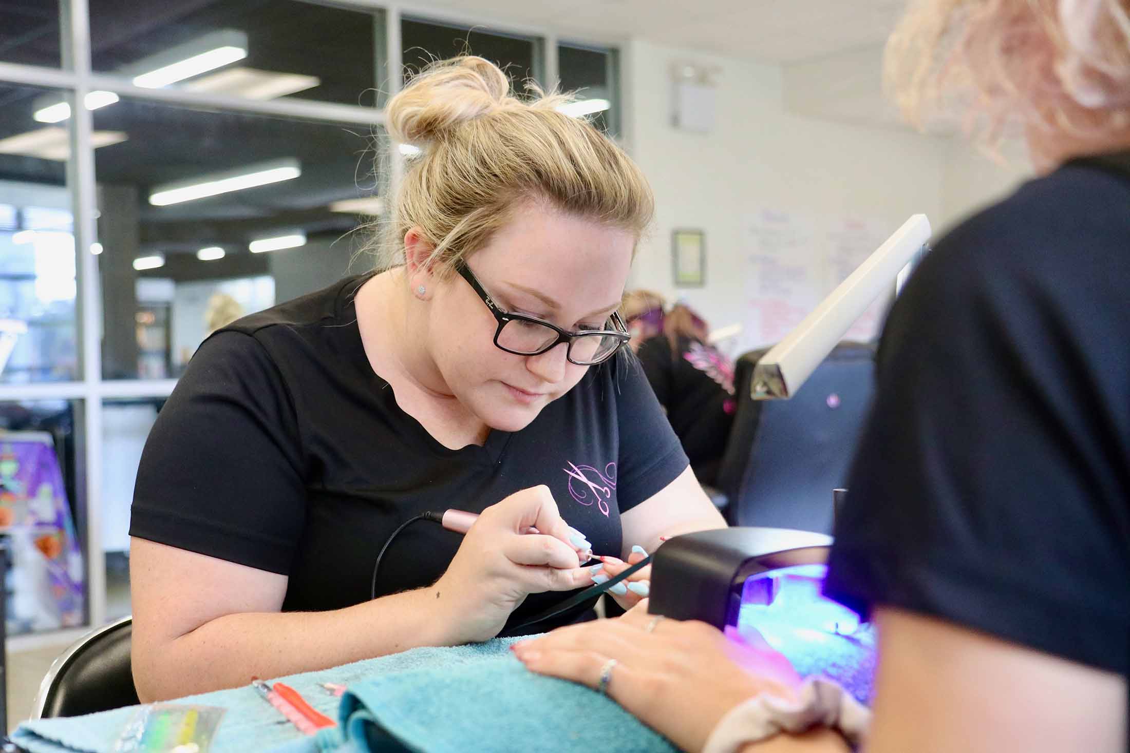 student doing nails